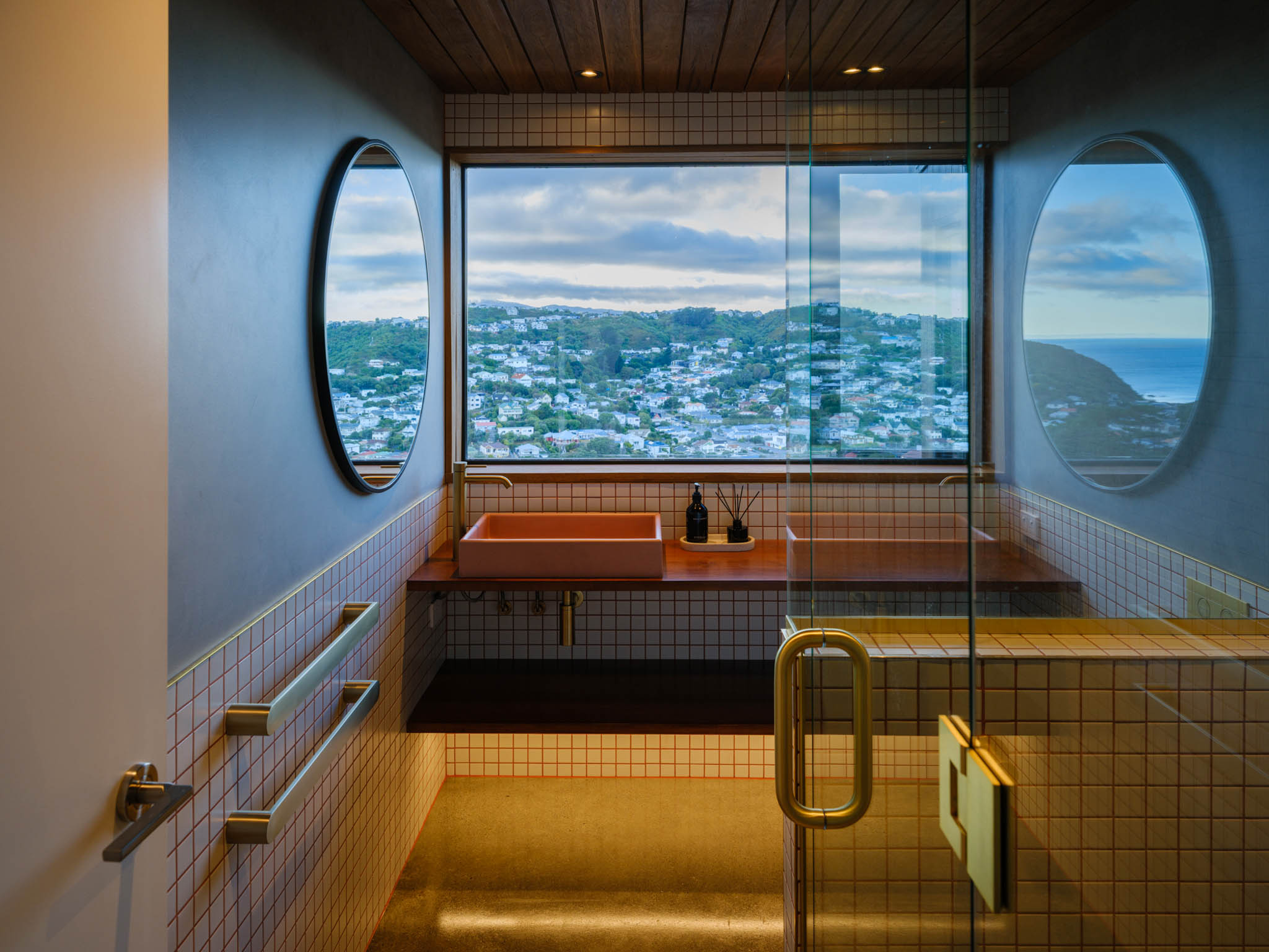 Bathroom with beautiful tiling and large window.jpg