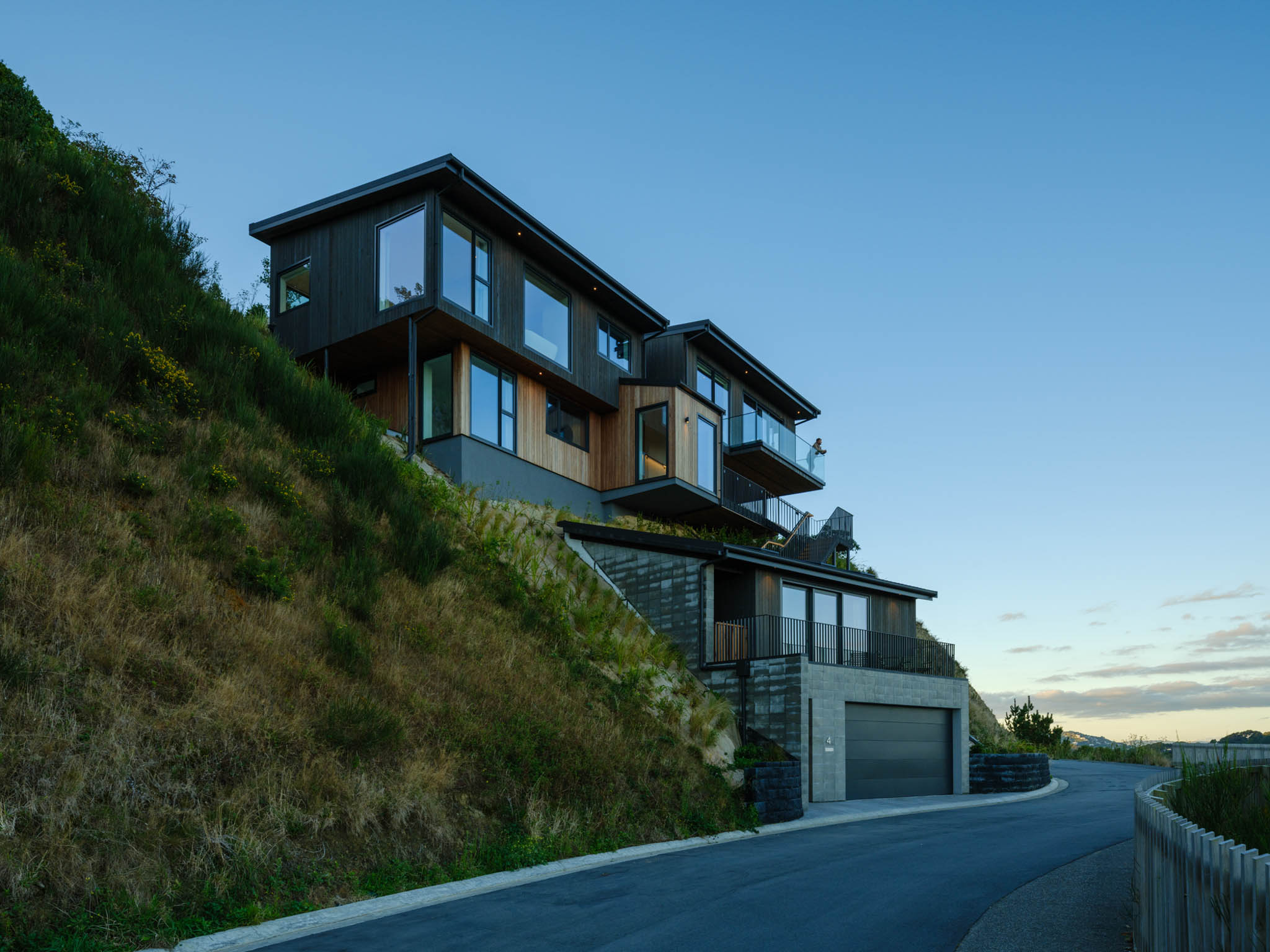 Exterior of architecturally-designed home nestled into a hillside.jpg