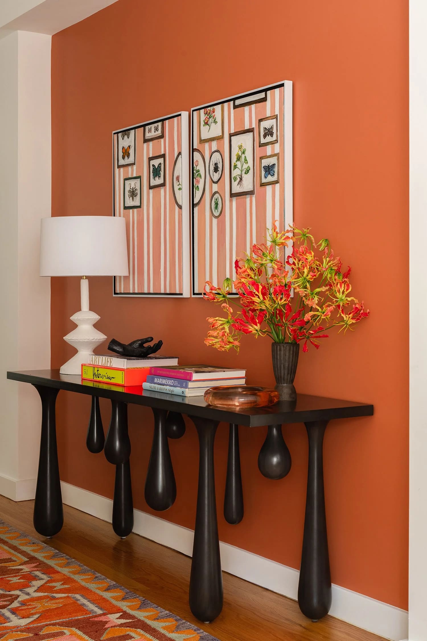 orange statement wall with abstract table.jpg