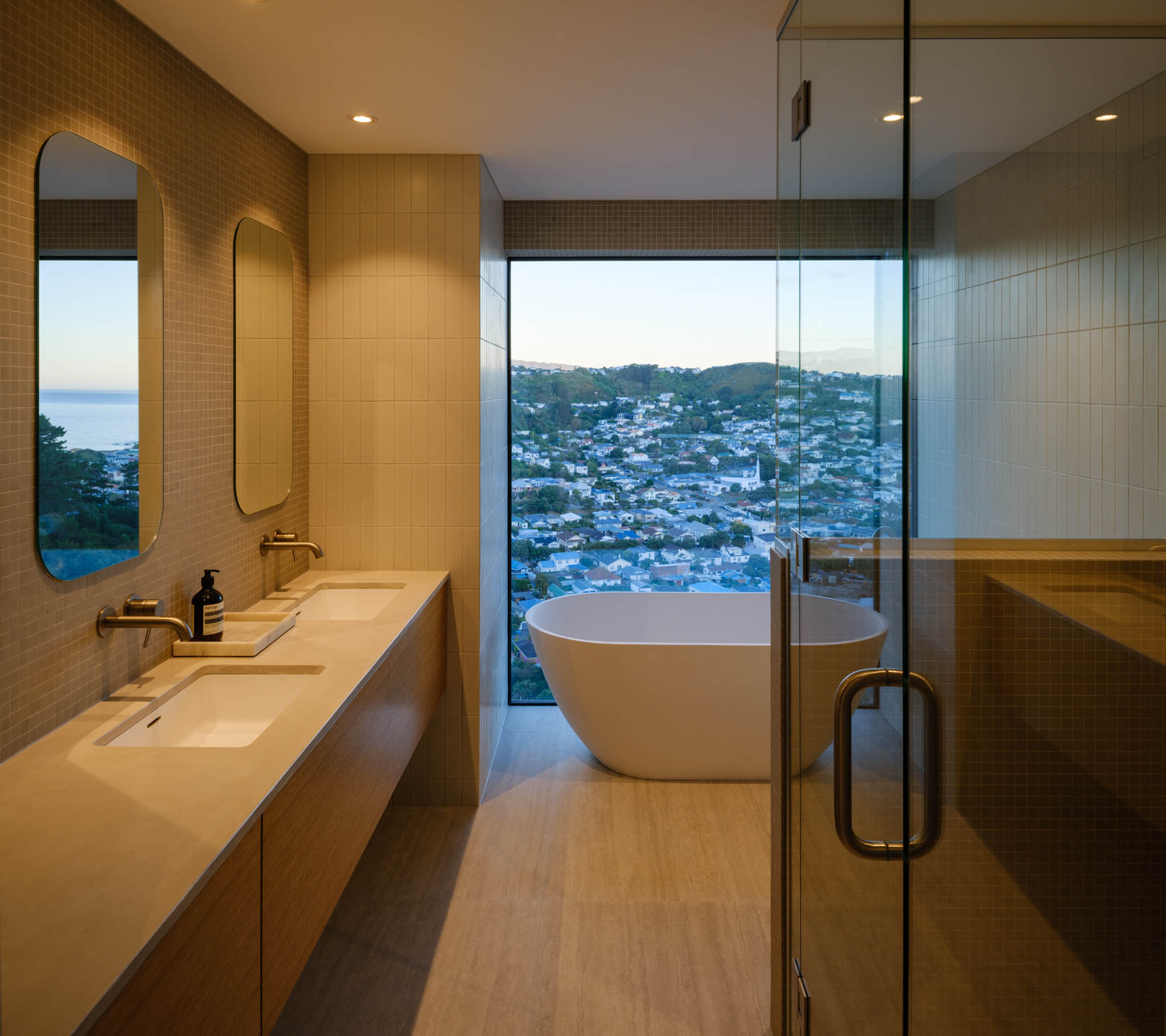 Luxury bathroom with standalone bathtub next to large window.jpg